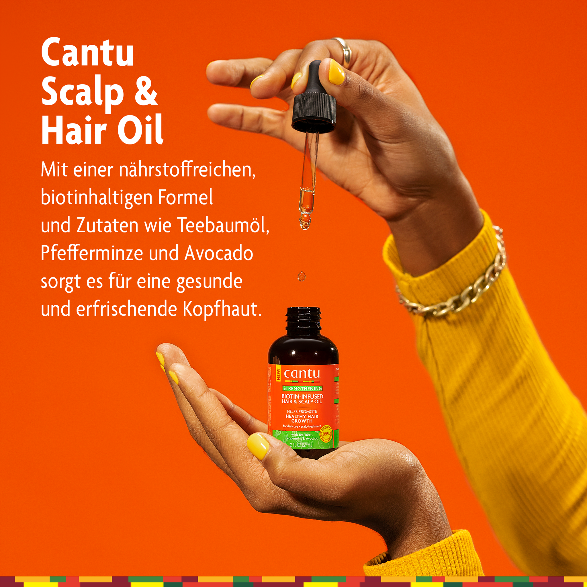 Cantu Scalp & Hair Oil auf Hand und Schrift auf orangefarbenen Grund