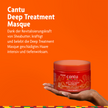 Cantu Deep Treatment Masque - 340g auf Hand und Schrift auf orangfarbenem Grund