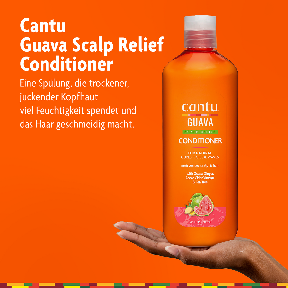 Cantu Guave Kopfhautpflege Conditioner - 400ml auf Hand und Schrift und orangefarbenem Grund