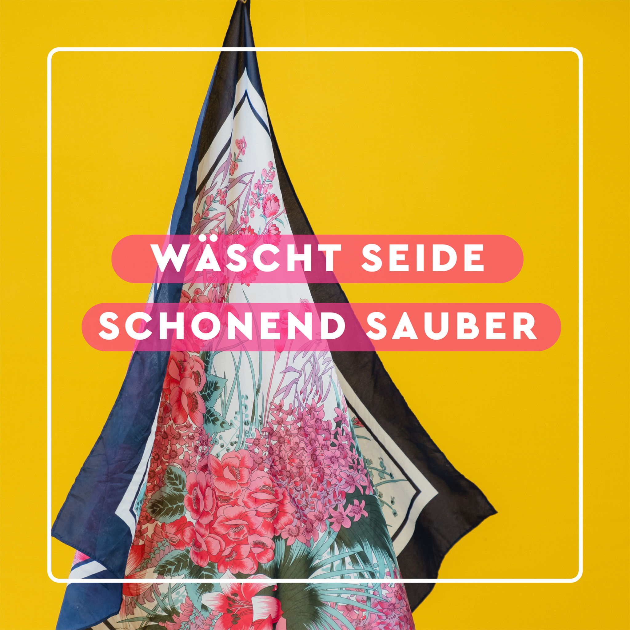 Seidentuch auf gelbem Grund und Schrift auf pinken Balken