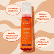 Cantu Wave Whip Curling Mousse - 248ml und Schrift in ovalen Kreisen auf gemustertem Grund