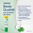 OHROPAX Ohren-Sensitive-Creme Tube auf grünem Grund, Cremeklecks, Pflanzen und Schrift