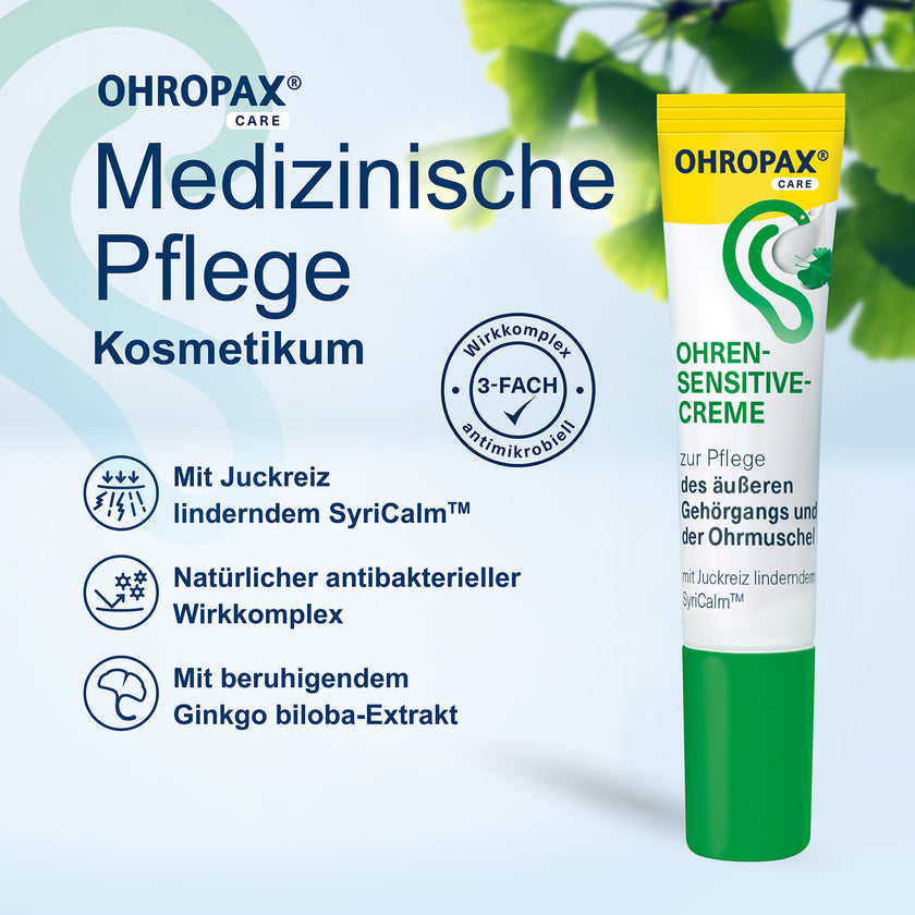 OHROPAX Ohren-Sensitive-Creme Tube auf blauem Grund mit Pflanzen dahinter und Schrift
