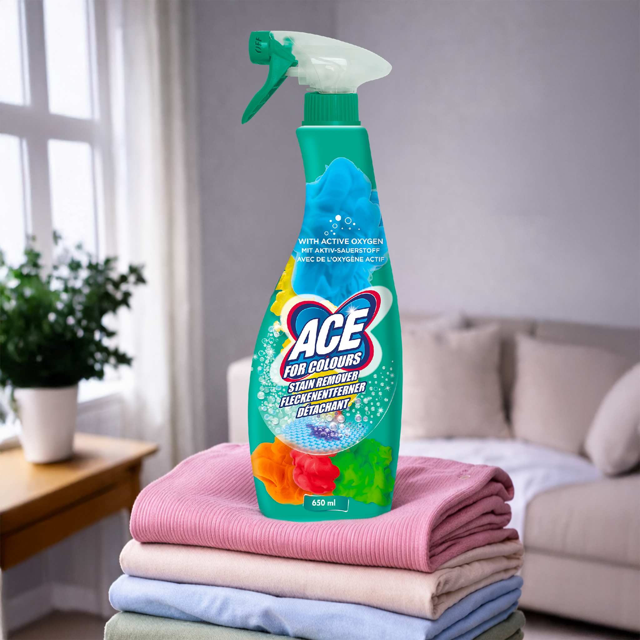 ACE Fleckenentferner Spray auf buntem Wäschestapel