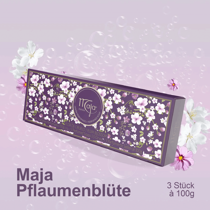 Maja Seife Pflaumenblüte - 3x100g auf fliederfarbenem Grund mit Blumen drumherum und Schrift unten im Bild
