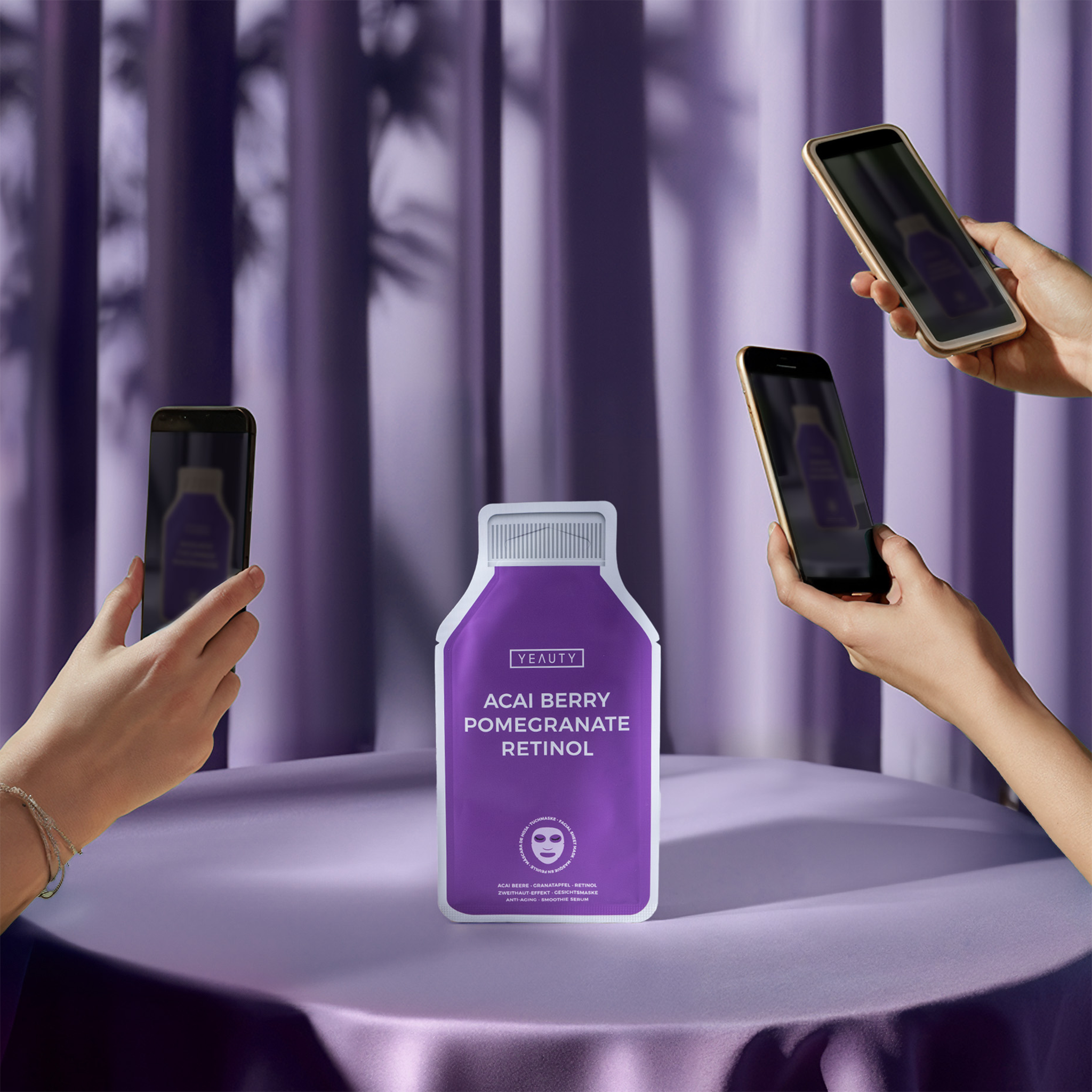 YEAUTY Tuchmaske Acai Berry Pomegranate Retinol auf Tisch wird fotografiert mit Handys