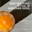 Glas mit Vit2go Immunity auf grauem Tisch von oben fotografiert und Schrift